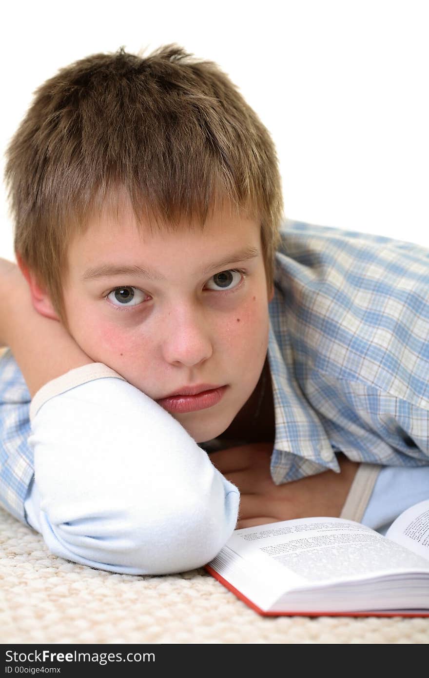 Young boy learning on the floor