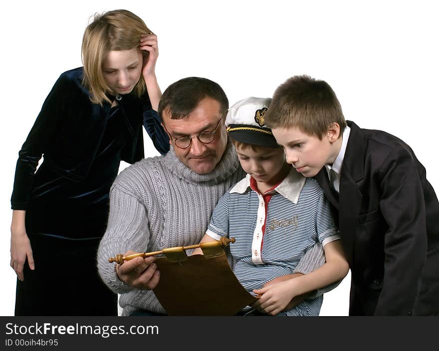 Studio. Isolated. The father tells to the children about the far countries and travel and shows a map. Studio. Isolated. The father tells to the children about the far countries and travel and shows a map