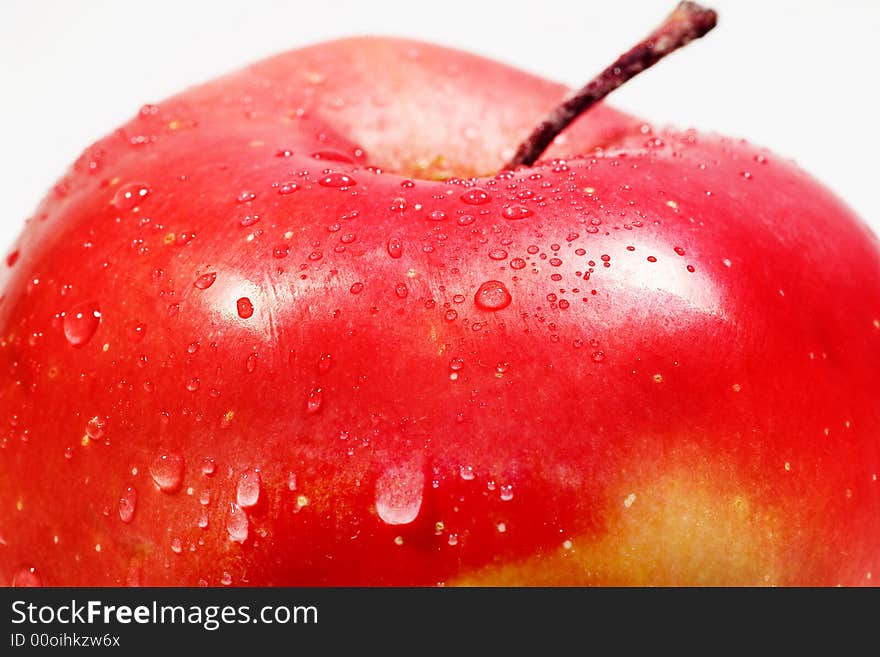 Red apple on the white background. Macro.