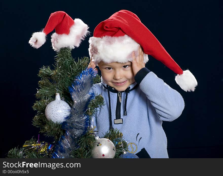 Boy wear a red cap for Christmas holiday. Boy wear a red cap for Christmas holiday