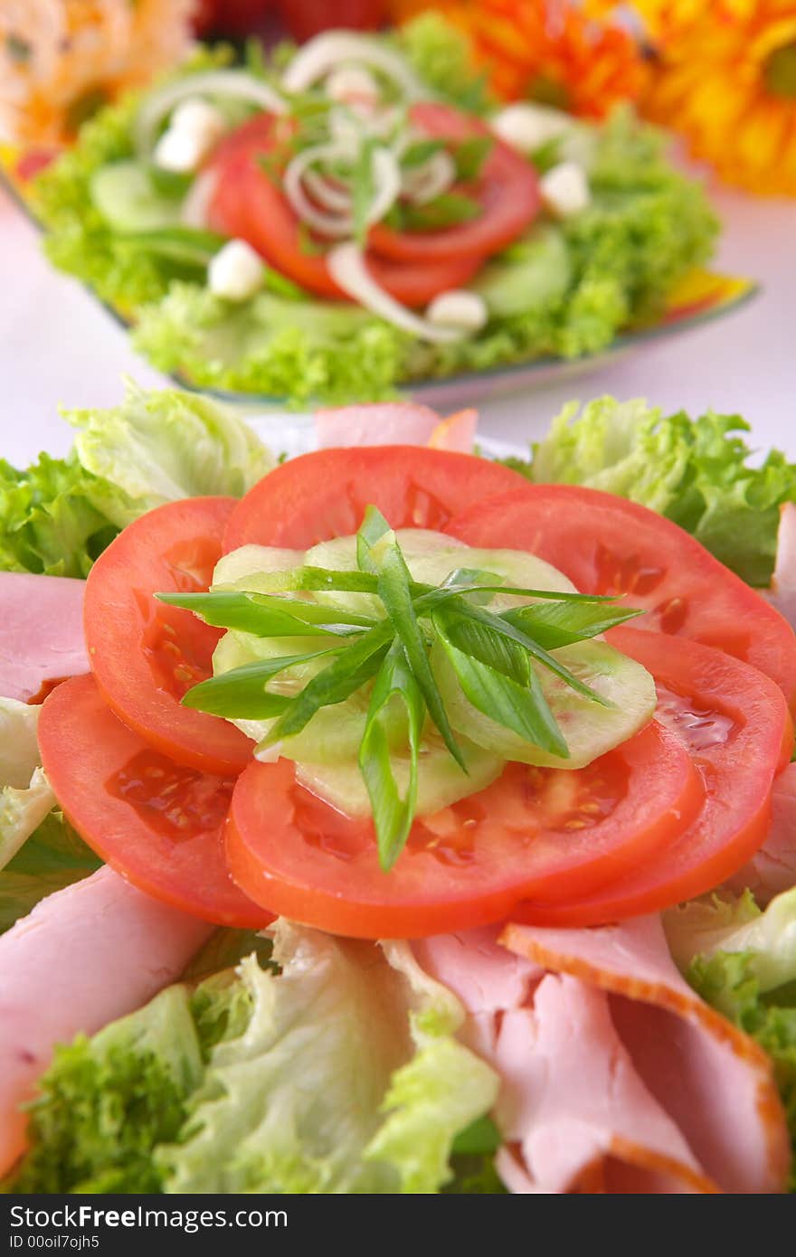 Fresh salad with onion, tomato and basil