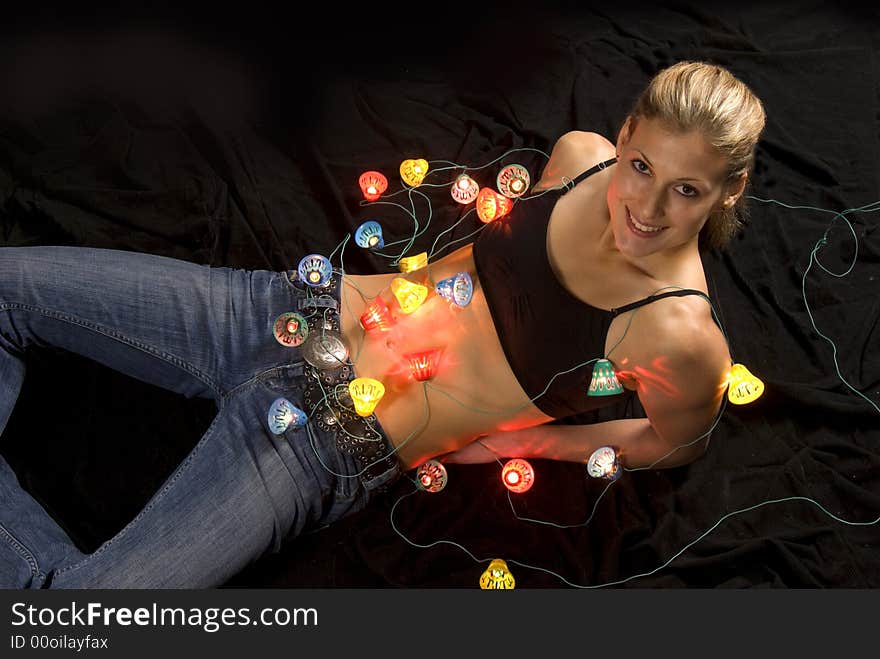 Sexual young woman with christmas lights