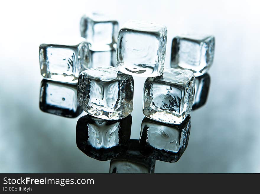 Melting ice cubes on blue background