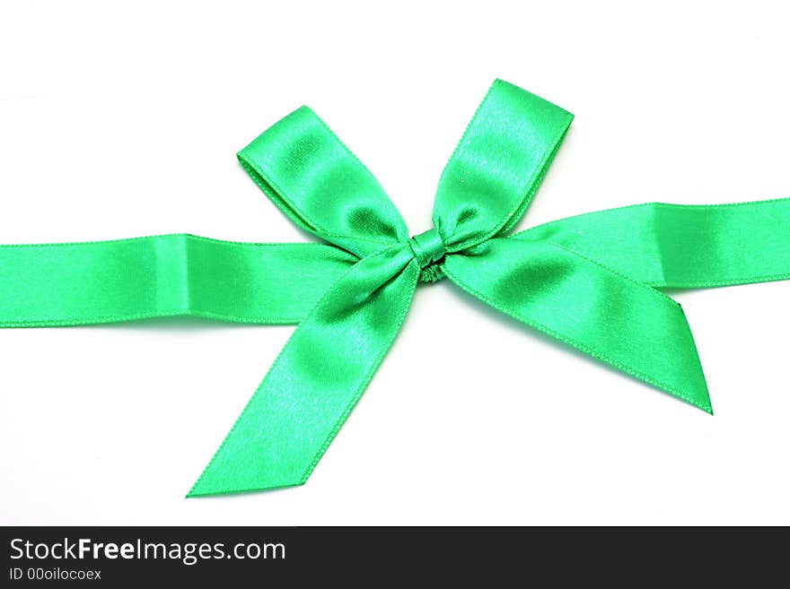 Green ribbon with bow isolated on white