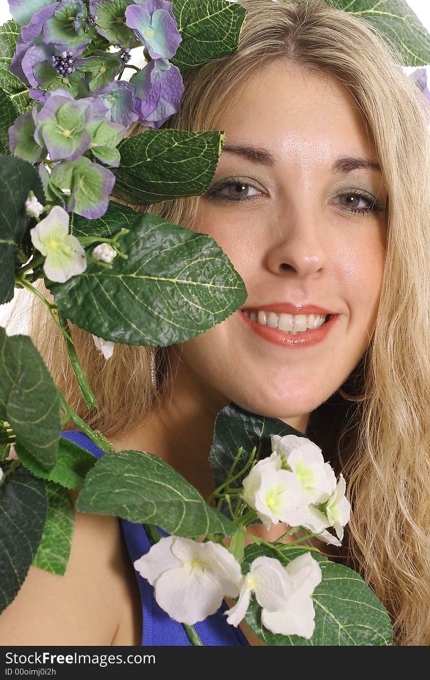 Woman in flowers smiling having a great day