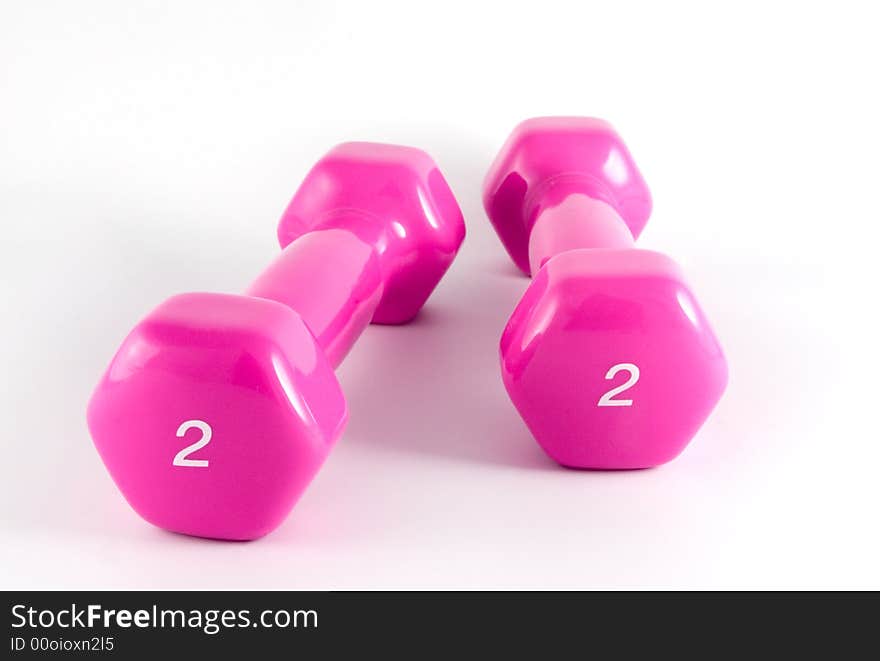 Two pink dumbbells