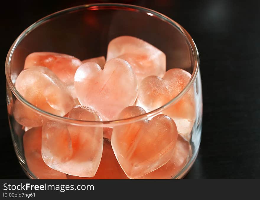 A bowl of heart shaped ice cubes for valentines day cocktailes