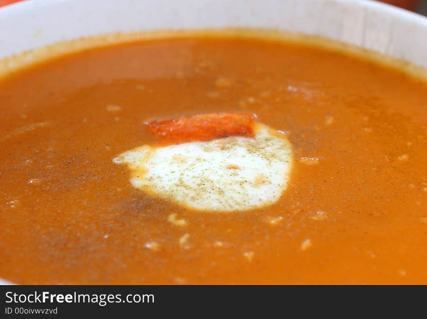 Carrot and orange soup with a dollop of creamy yogurt and sprinkle of thyme