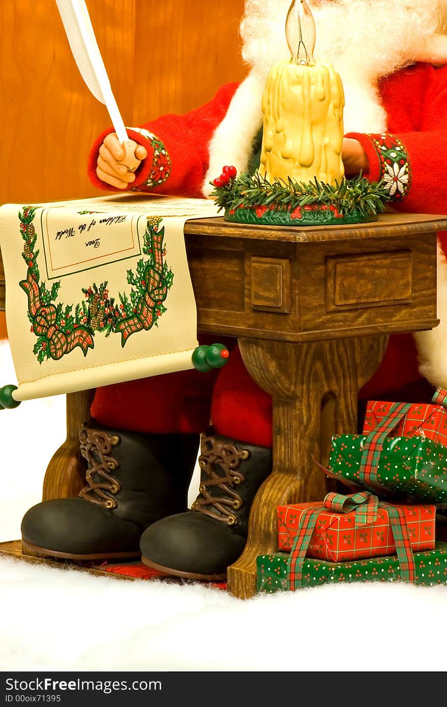 A view of a Santa Claus sitting at a small desk, writing a list of all the boys and girls who will get Christmas toys with Christmas presents piled at his feet. A view of a Santa Claus sitting at a small desk, writing a list of all the boys and girls who will get Christmas toys with Christmas presents piled at his feet.