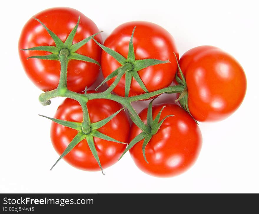 Isolated fresh tomatoes with stems closeup (vivid colors)