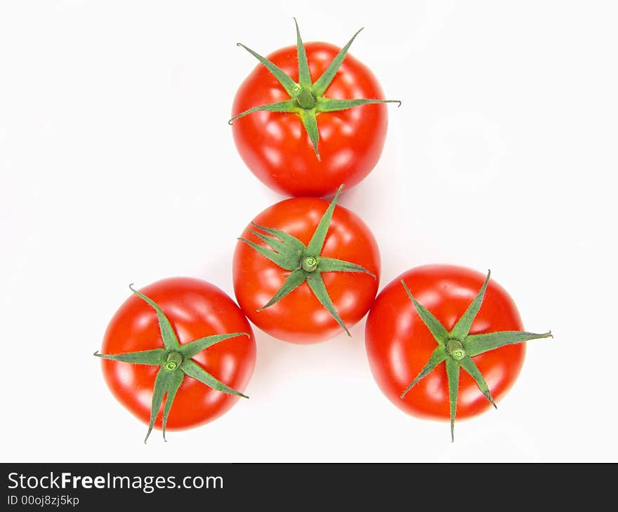 Isolated fresh tomatoes with stems closeup (vivid colors)