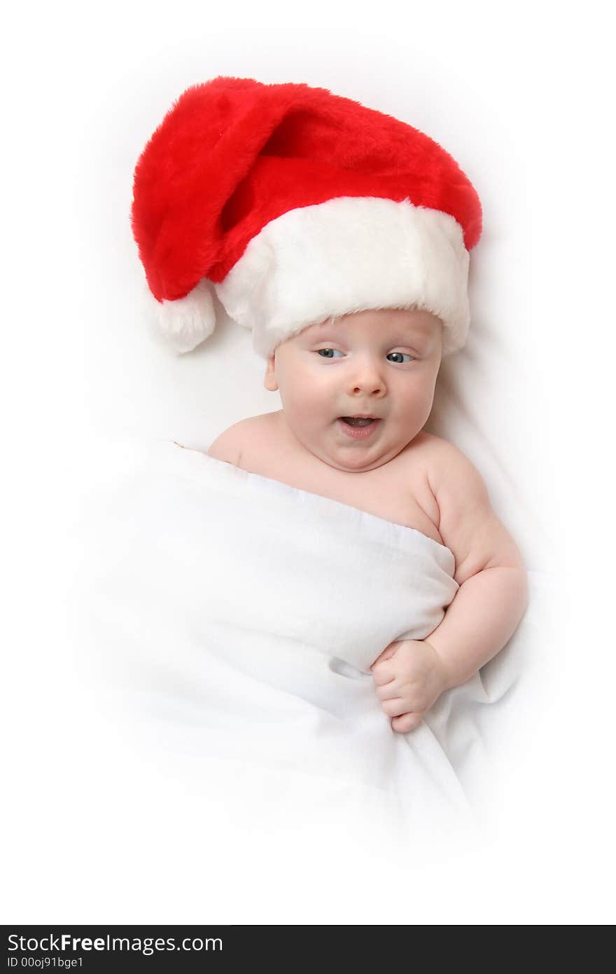 The Child in red hat of Santa on white background. The Child in red hat of Santa on white background.