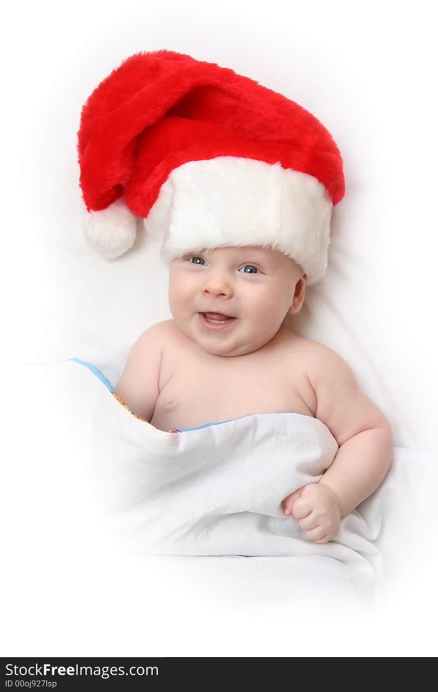 The Child in red hat of Santa on white background. The Child in red hat of Santa on white background.