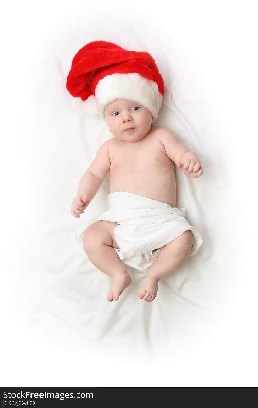 The Child in red hat of Santa on white background. The Child in red hat of Santa on white background.