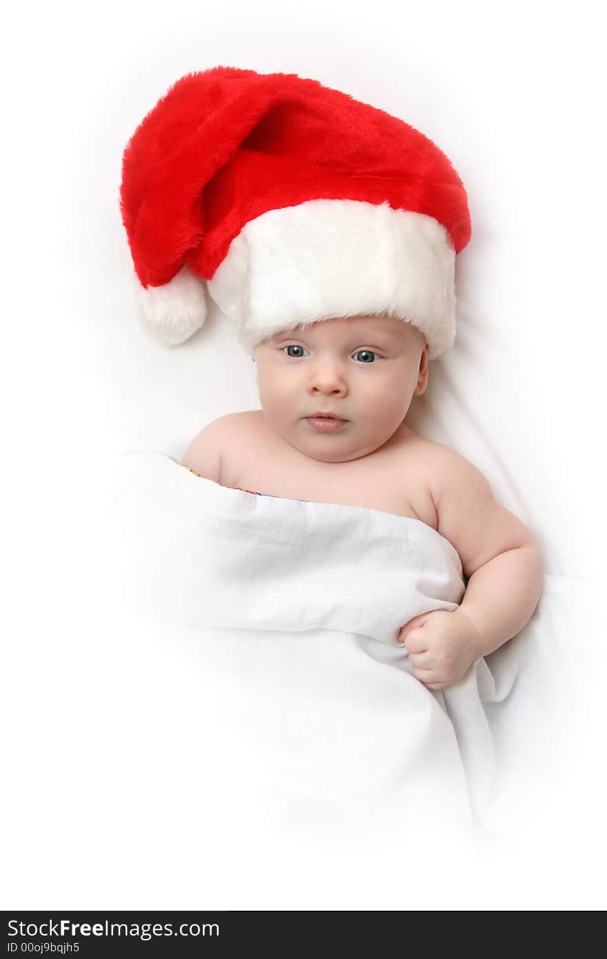 The Child in red hat of Santa on white background. The Child in red hat of Santa on white background.