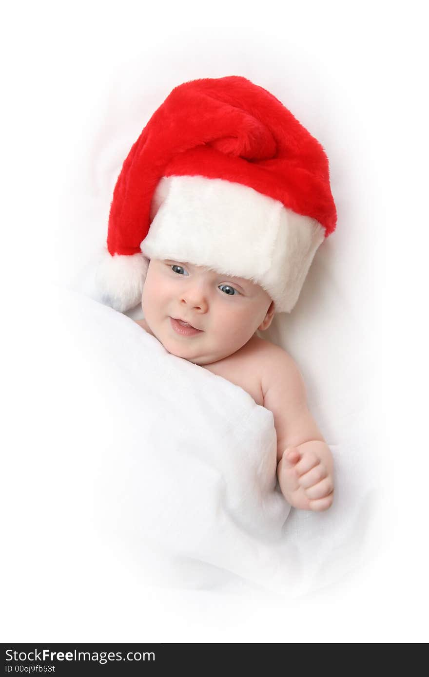 The Child in red hat of Santa on white background. The Child in red hat of Santa on white background.