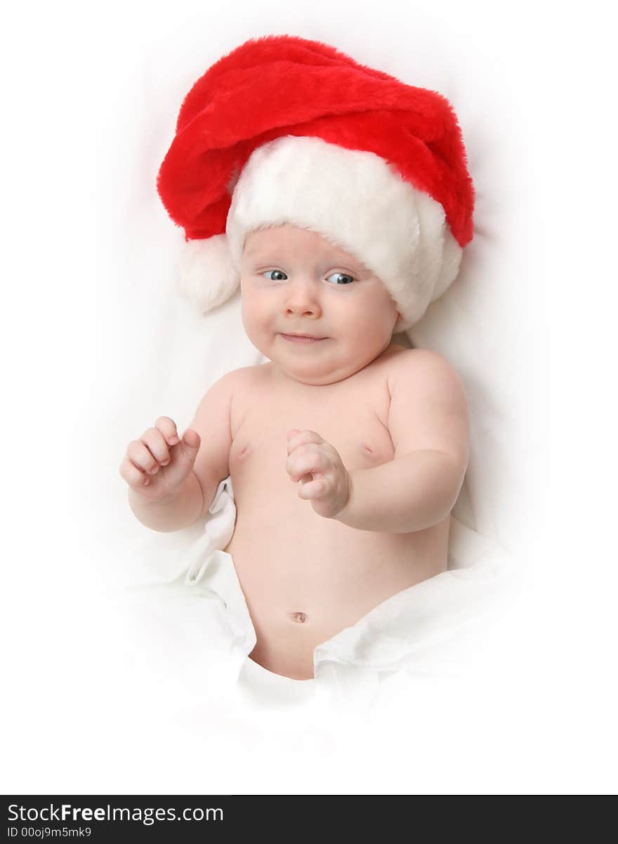 The Child in red hat of Santa on white background. The Child in red hat of Santa on white background.