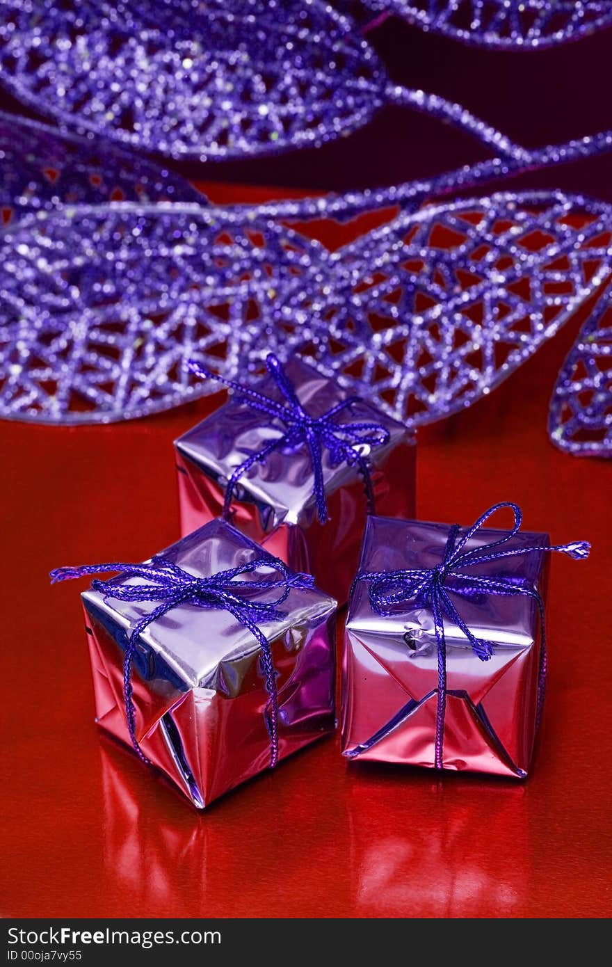 Gift boxes on red background with leaf