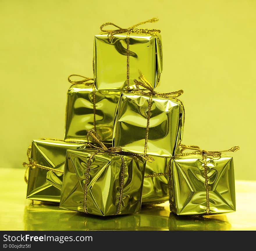 Stack of golden gift boxes