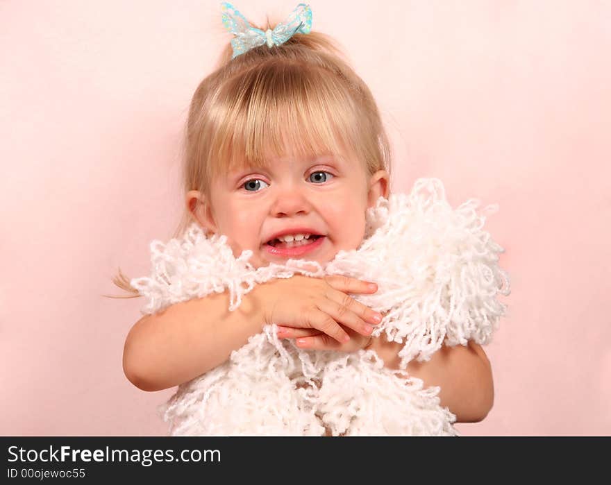 Adorable little girl playing with scarf. Adorable little girl playing with scarf