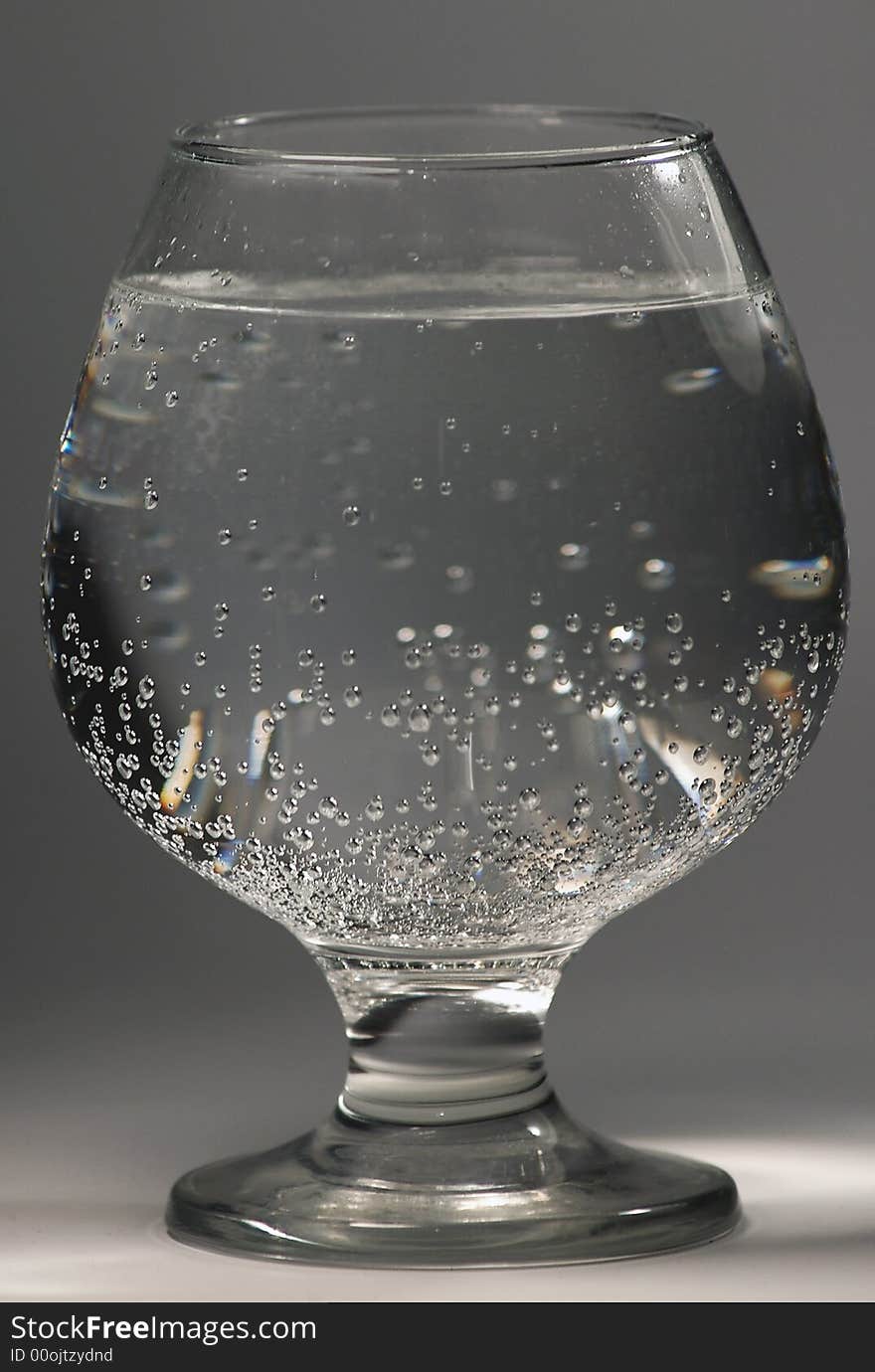 Glass with water on a white background