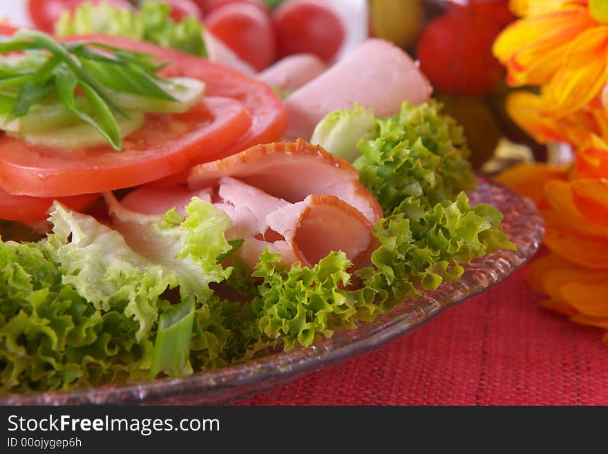 Fresh salad with onion, tomato and basil