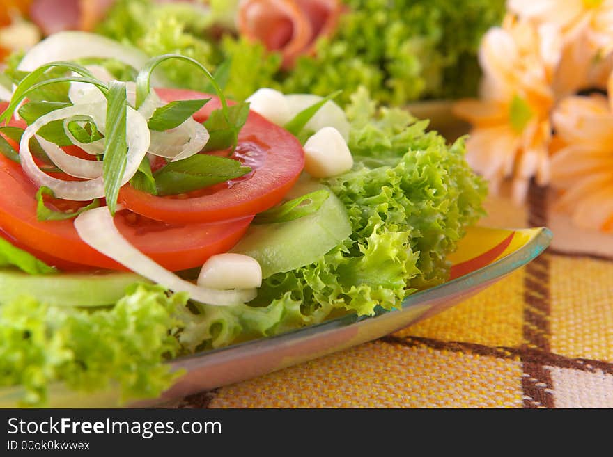 Fresh salad with onion tomato and basil