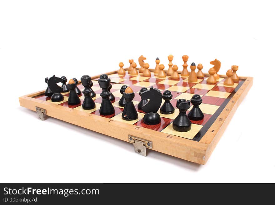 Old chess set on the white background