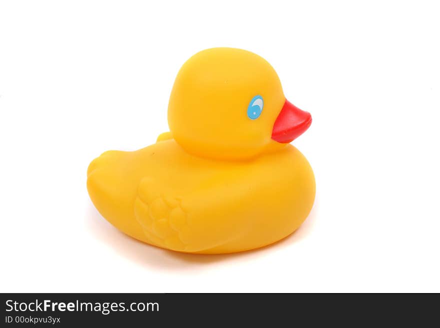 Plastic yellow duck on the white background. Plastic yellow duck on the white background