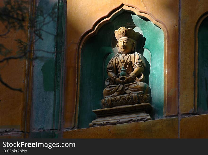 A beam of light illuminates the image of a Buddha on the Pavilion of the Fragrance of Buddha The Summer Palace (Yiheyuan), Beijing, China. A beam of light illuminates the image of a Buddha on the Pavilion of the Fragrance of Buddha The Summer Palace (Yiheyuan), Beijing, China