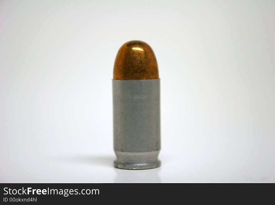 Handgun Bullet close up with a white background