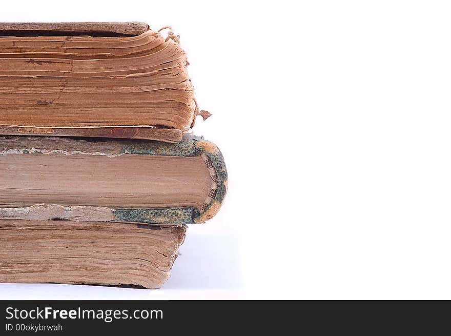 Three ancient vintage books isolated on white background. Halb view. Three ancient vintage books isolated on white background. Halb view.