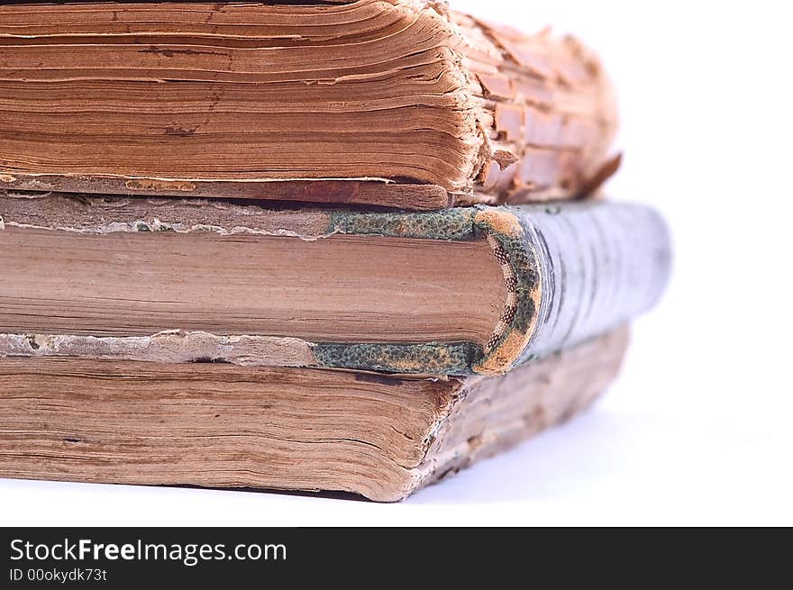 Three ancient vintage books isolated on white background. Halb view. Three ancient vintage books isolated on white background. Halb view.