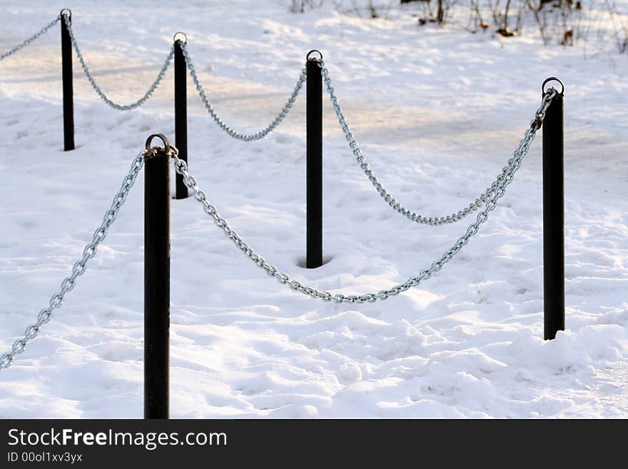 Fence of the chain on the snow. Fence of the chain on the snow