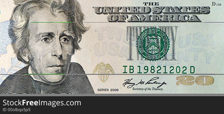 Macro shot of a 20 dollar bill, includes Andrew Jackson's portrait.