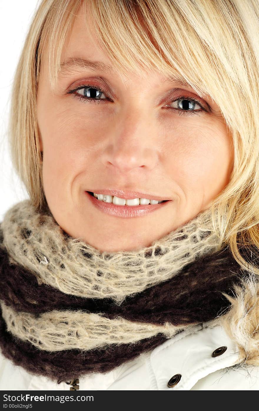 Beautiful woman wearing a warm winter coat and scarf