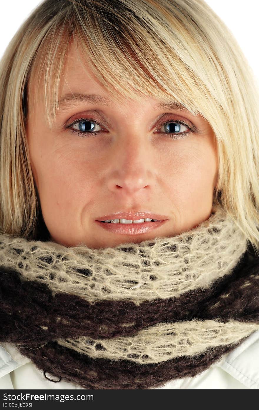 Beautiful woman wearing a warm winter coat and scarf