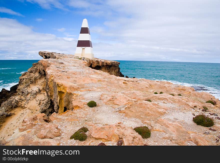 The Robe Obelisk. Erected on Cape Dombey in 1852, the Obelisk was used to navigate the entrance to Guichen Bay and to store rocket lifesaving equipment. It later assisted passing ships with navigation because its height of 12m (40 ft) makes it visible 20km (12 miles) out to sea. The erosion of the land surrounding the obelisk will mean it will eventually fall away. The Robe Obelisk. Erected on Cape Dombey in 1852, the Obelisk was used to navigate the entrance to Guichen Bay and to store rocket lifesaving equipment. It later assisted passing ships with navigation because its height of 12m (40 ft) makes it visible 20km (12 miles) out to sea. The erosion of the land surrounding the obelisk will mean it will eventually fall away.