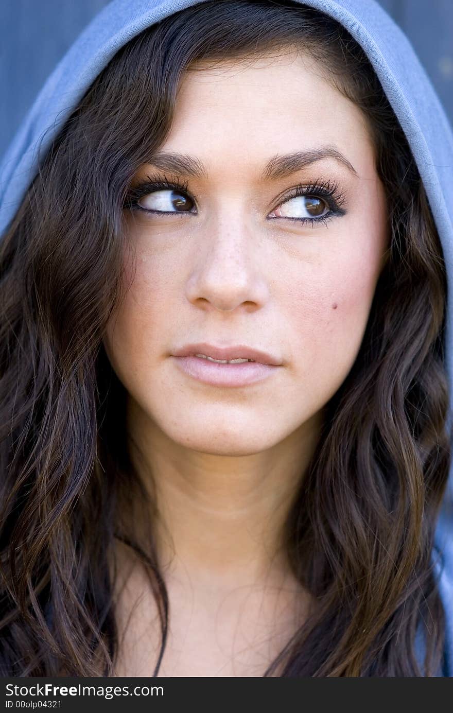 Beautiful young woman with eyes looking up