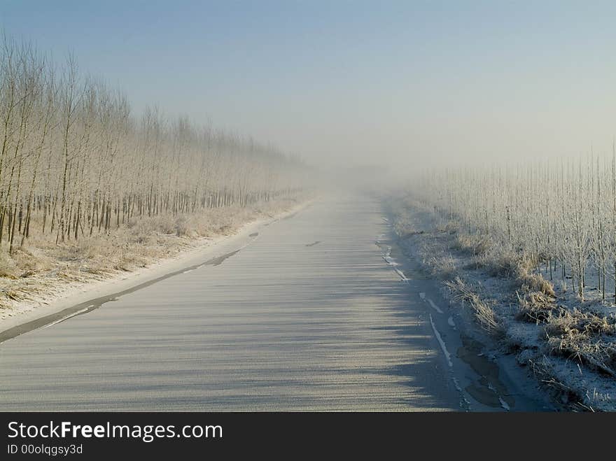 The main aqueduct for irrigation is frozen in extreme cold. Everything is in white. The main aqueduct for irrigation is frozen in extreme cold. Everything is in white.