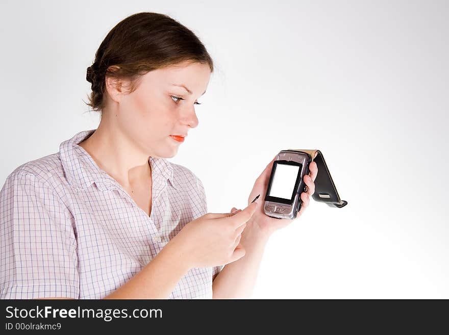 Pretty girl with a smartphone on white and grey background