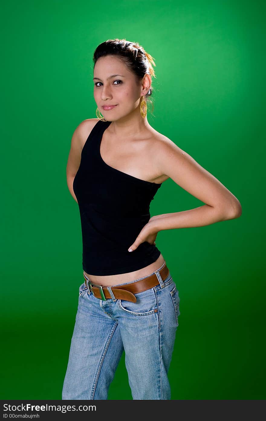 A casual beautiful eurasian girl in jeans and one strap top