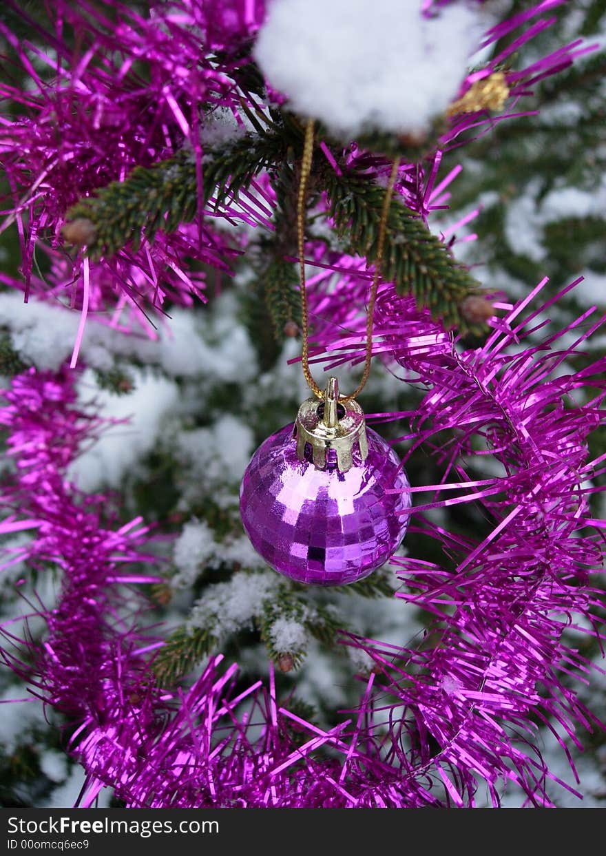 Pink christmas ball - christmas tree under snow