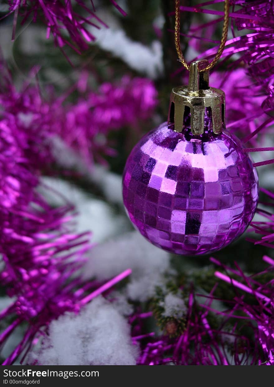 Pink christmas ball - christmas tree under snow