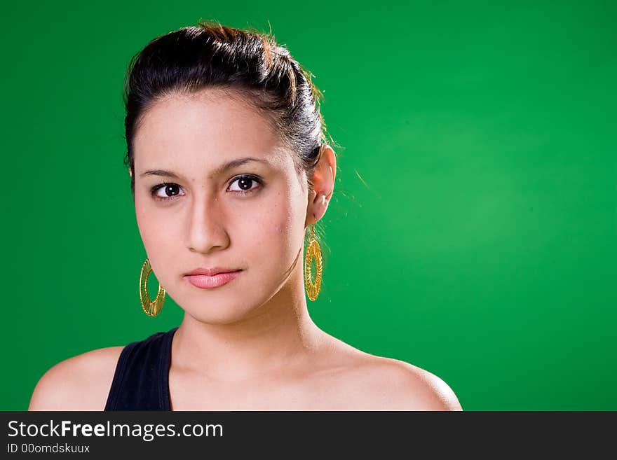 Alluring look of a young woman in black single strap top. Alluring look of a young woman in black single strap top