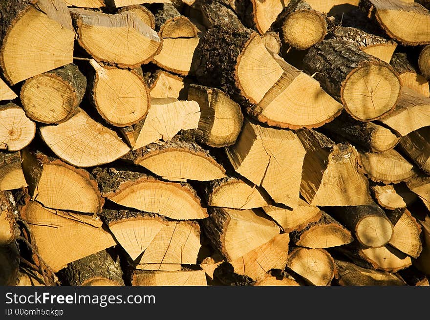 Dry yellow pile of logs stacking abreast. Dry yellow pile of logs stacking abreast