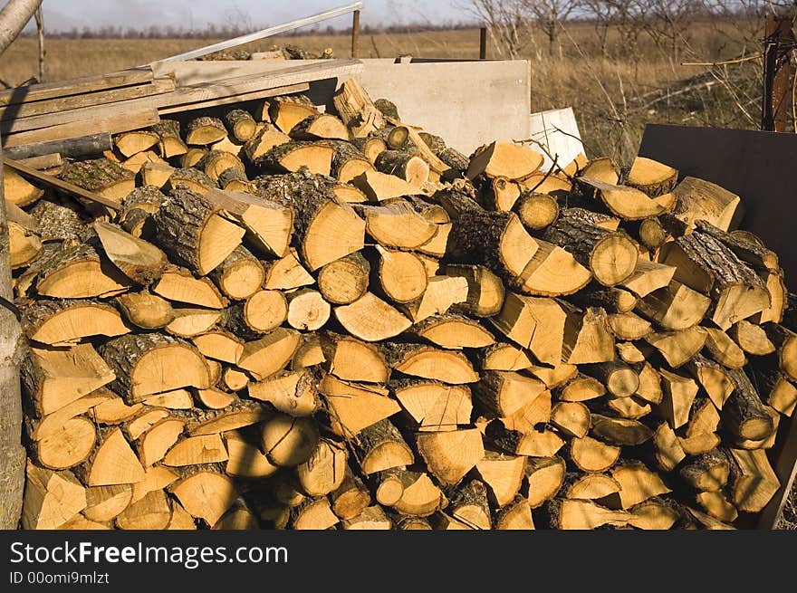 Dry yellow pile of logs stacking abreast. Dry yellow pile of logs stacking abreast