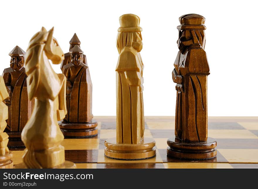 Opposition two chess king. The placed party from chessmen. Figures - from a tree, manual work