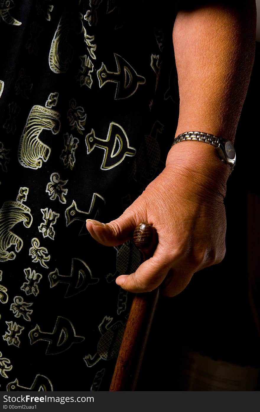 Shot of an elderly lady's hand on her cane. Shot of an elderly lady's hand on her cane.