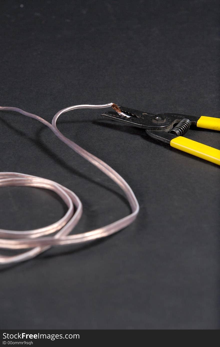 Wire strippers stripping some copper wire